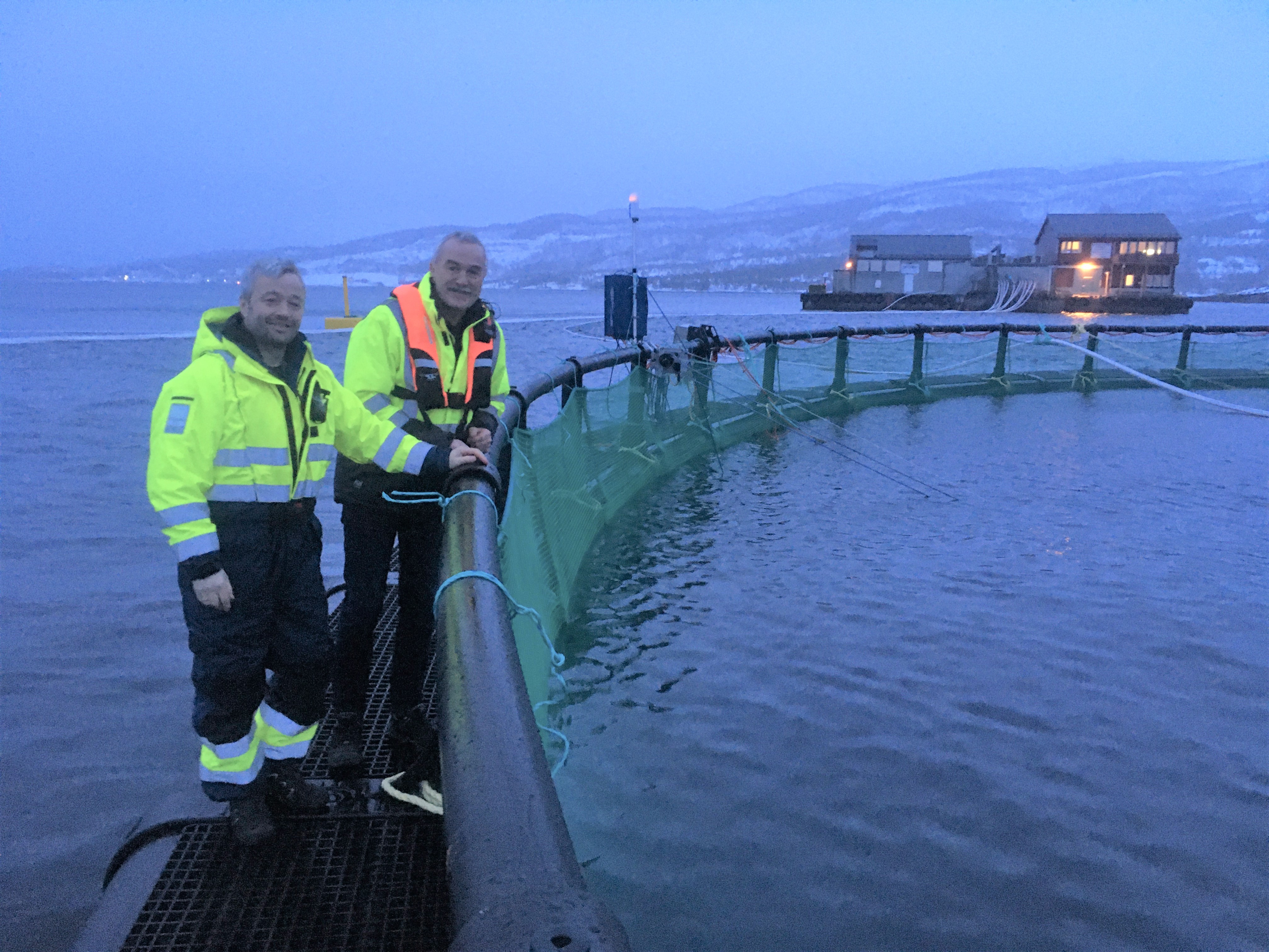 Helge Stormyr (right) of Arctic Havservice meeting a fish farmer in the Norland region of Norway to discuss the benefits of the AutoBoss net washer