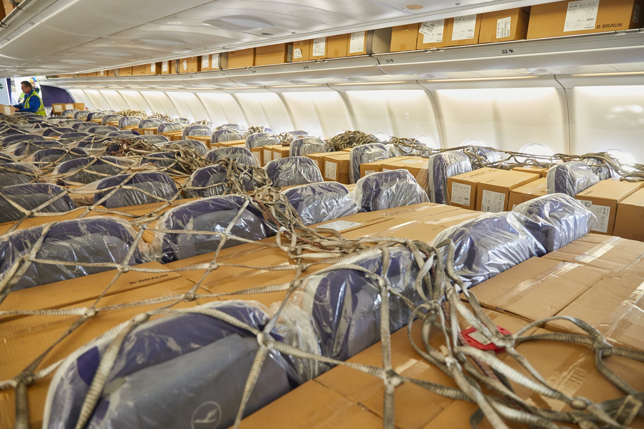 Cargo strapped into passenger seats aboard a Lufthansa A330 (photo: Lufthansa)