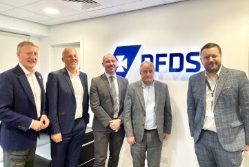Neil Gray, Scotland's Secretary for Wellbeing Economy, Fair Work and Energy (centre) visits logistics business DFDS with Salmon Scotland's Tavish Scott (1st from left)