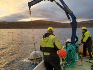 Firum team retrieving a wave and current buoy from Kaldbaksfjord