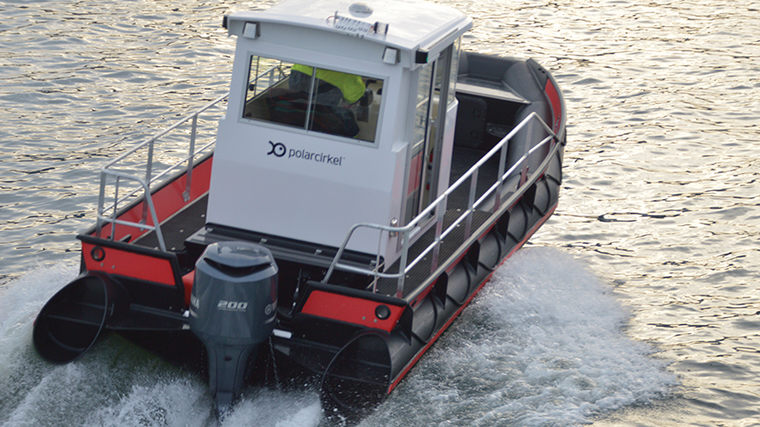 workboat moving fast at sea