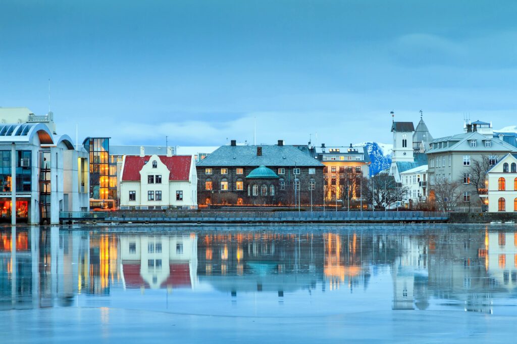 Beautiful reflection of the parliament house Althing of Reykjavik in lake Tjornin